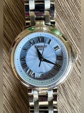 LIKE NEW - TISSOT LADIES STAINLESS STEEL BLUE FACE BELLISSIMA SMALL
WATCH
